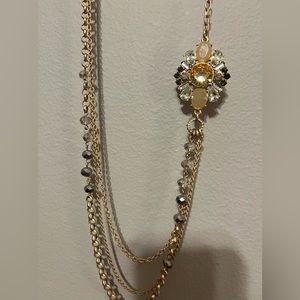 Long gold layered necklace with flower broach